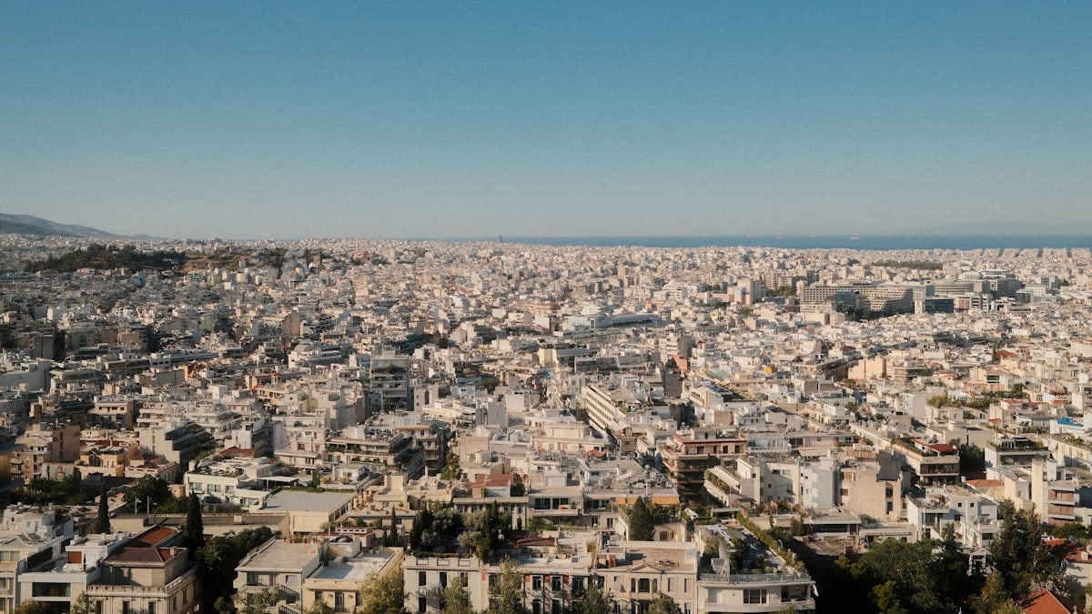 Expansive cityscape under a clear blue sky